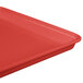 A red MFG Tray fiberglass display tray with a corner.