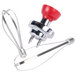 A red and silver metal KitchenAid whisk attachment with wire.