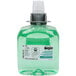 A GOJO® FMX-12 bottle of green liquid hand soap.