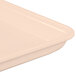 A white rectangular MFG Tray with a peach color.