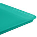 A mint green MFG Tray with a blue surface.