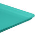 A mint green MFG Tray market and bakery display tray with a fiberglass surface.
