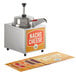 A Carnival King nacho cheese warmer with a heated pump on a school kitchen counter.