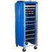A blue Heavy Duty Bun Pan Rack cover on a cart with trays.