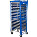 A blue and silver Heavy Duty Bun Pan Rack cover on a rack with wheels.