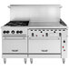 A large stainless steel Vulcan commercial gas range with 4 burners, a 36 inch manual griddle, and 2 ovens.