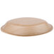 A close-up of a TreeVive by EcoChoice oval palm leaf bowl on a wooden surface.