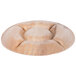 An EcoChoice palm leaf deli tray with a circular design carved into it.