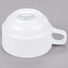 A white porcelain espresso cup with a handle.
