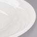 A close-up of a Libbey ivory porcelain pasta bowl with a wide rim.