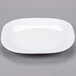 A white Libbey porcelain square coupe plate with a small rim.