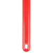 A red plastic tool with a hole in the middle.