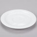 A Libbey Reflections white porcelain saucer with a circular shape.