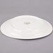 A Libbey ivory porcelain oval plate with a medium rim.
