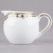 A white and gold Syracuse China creamer with a gold Baroque design.