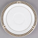 A white Syracuse China saucer with brown and black Baroque design.