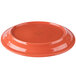 An orange Libbey Cantina porcelain oval platter with a carved design.