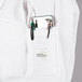 A white Mercer Culinary women's chef jacket with a pen pocket.