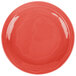 A red Libbey Cantina porcelain plate with a wavy circular design on the surface.