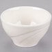 A Libbey ivory porcelain bowl with a wavy design on it.