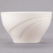 A Libbey ivory round porcelain bowl with a curved design.