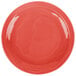 A red Libbey Cayenne porcelain plate with a wavy circular design.