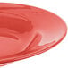 A red Libbey porcelain pasta bowl with a white background.