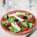 A Libbey Cantina porcelain round plate with a salad of chicken, berries, and spinach.