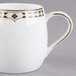 A white Syracuse China creamer with gold trim.
