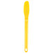 A yellow plastic HS Inc. sandwich spreader with a yellow liquid on a white background.