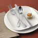 A plate with a Reserve by Libbey stainless steel utility/dessert fork on it.