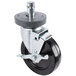 A black Metro caster wheel with a silver metal stem.