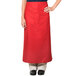 A person wearing a red Intedge bistro apron with pockets.
