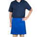 A man wearing a blue Intedge waist apron.