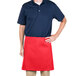 A man wearing a red Intedge waist apron.