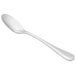 A silver Libbey stainless steel demitasse spoon with a white handle.