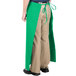 A person wearing a green Intedge bistro apron with pockets.