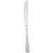 A Libbey stainless steel dinner knife with a fluted handle on a white background.