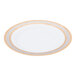A white porcelain dinner plate with gold trim on the rim.