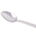 A Libbey stainless steel iced tea spoon with a white handle and a white bowl.