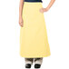 A woman wearing a yellow Intedge bistro apron with two pockets.