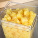A container of Del Monte pineapple chunks in juice.