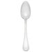 A Libbey stainless steel dessert spoon with a white handle and bowl on a white background.