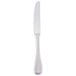 A silver Libbey stainless steel dinner knife with a white handle on a white background.