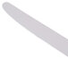 A white Libbey Aspen dinner knife with a white handle.