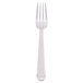 A Libbey stainless steel dinner fork with a white handle.