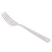 A Libbey stainless steel dinner fork with a white handle.