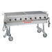 A large stainless steel MagiKitch'n MagiCater grill with wheels.
