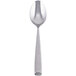 A silver Libbey Chivalry dessert spoon with a white background.