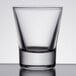 A close-up of a clear Libbey shot glass.